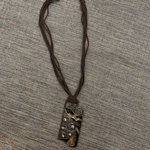 Very beautiful pendant with stones, pretty with shirts and open neck t-shirts